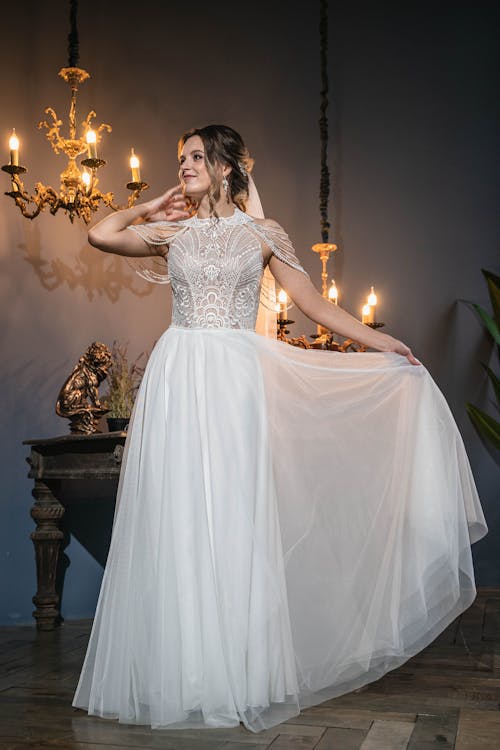 A Pretty Woman in White Dress Posing