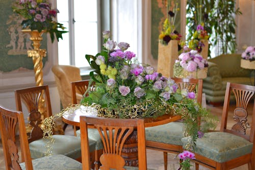 Purple Petaled Flowers on Brown Table