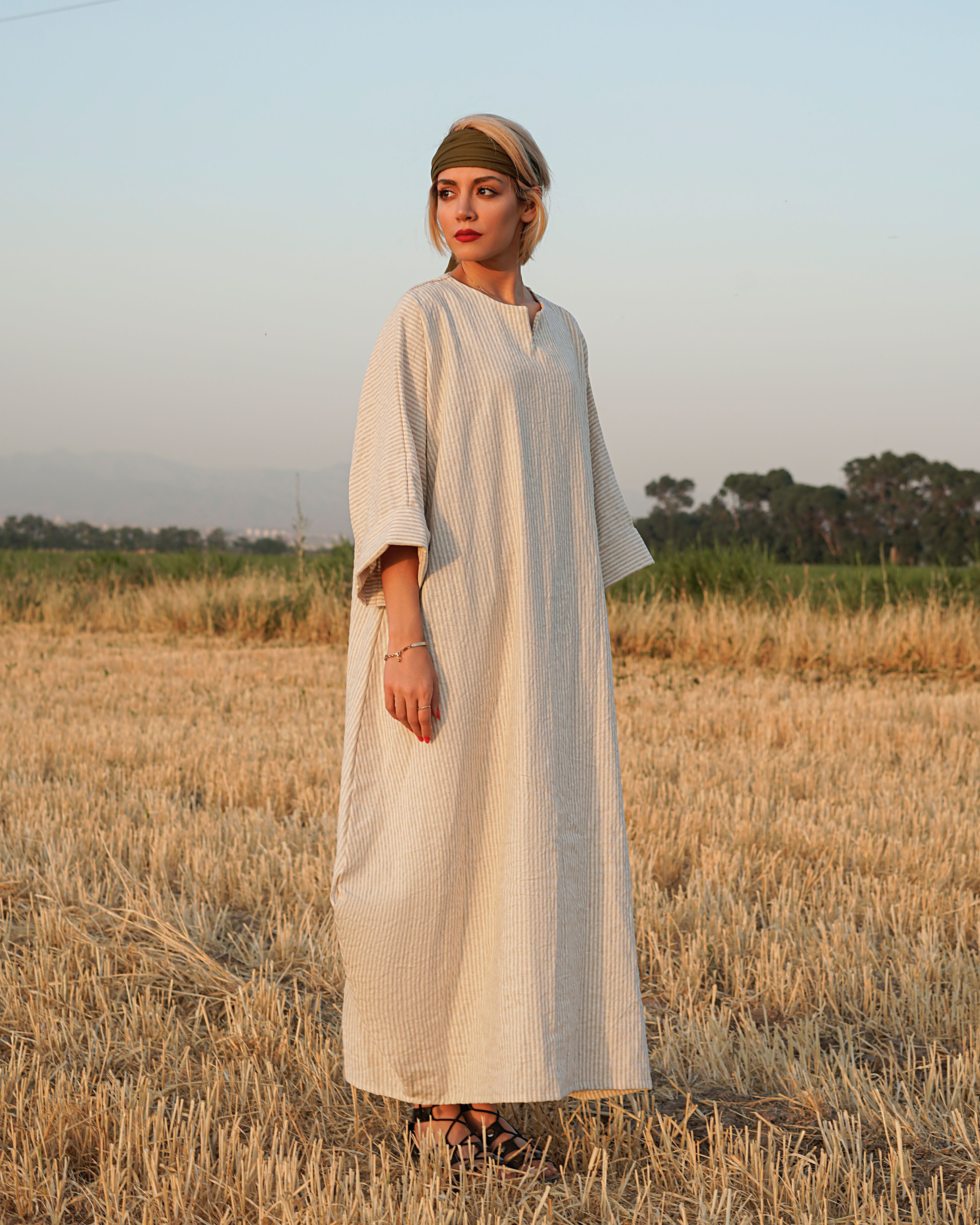 Woman in White Long Sleeve Dress Standing on Brown Grass Field · Free ...