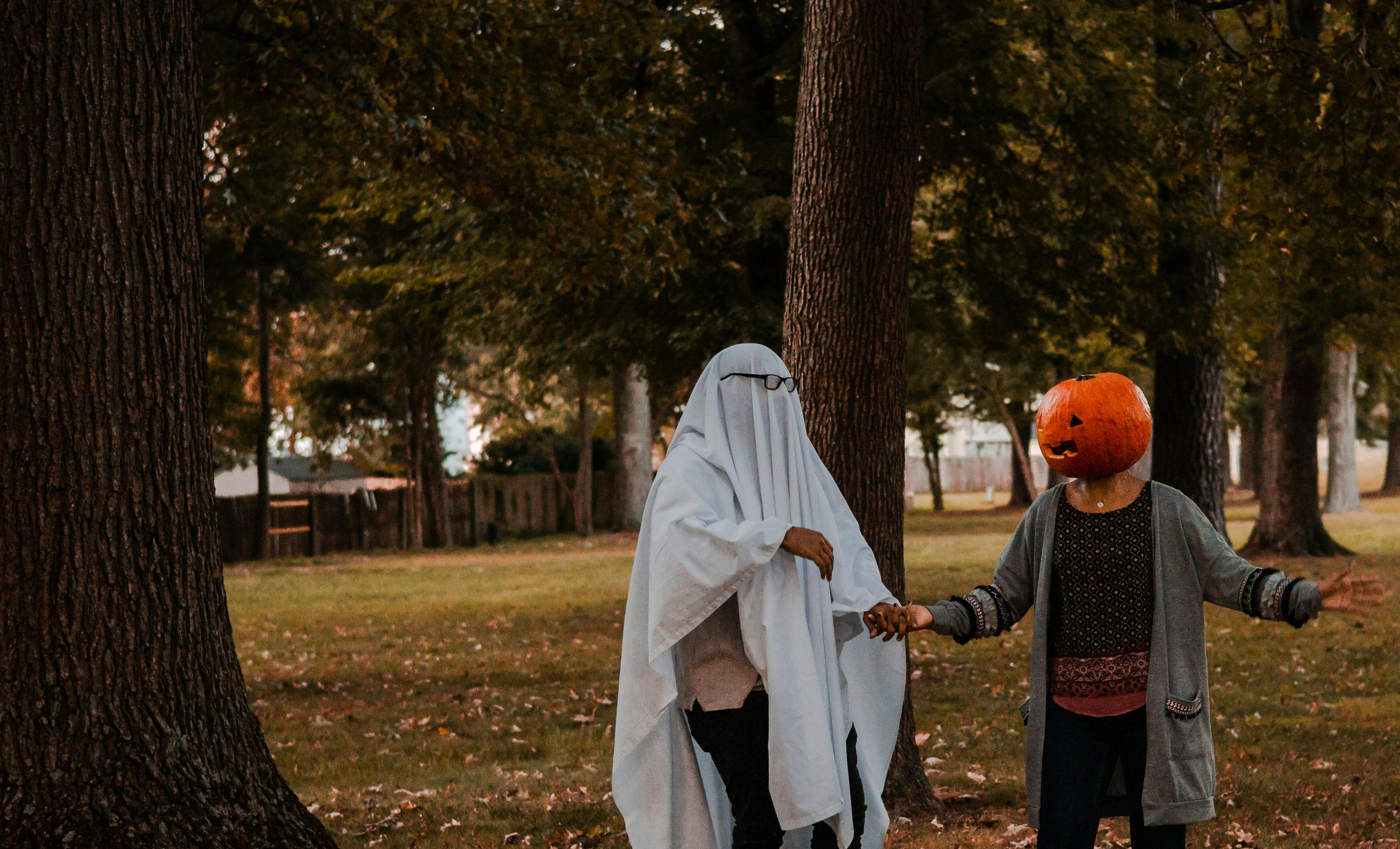 people at the park wearing scary halloween costumes