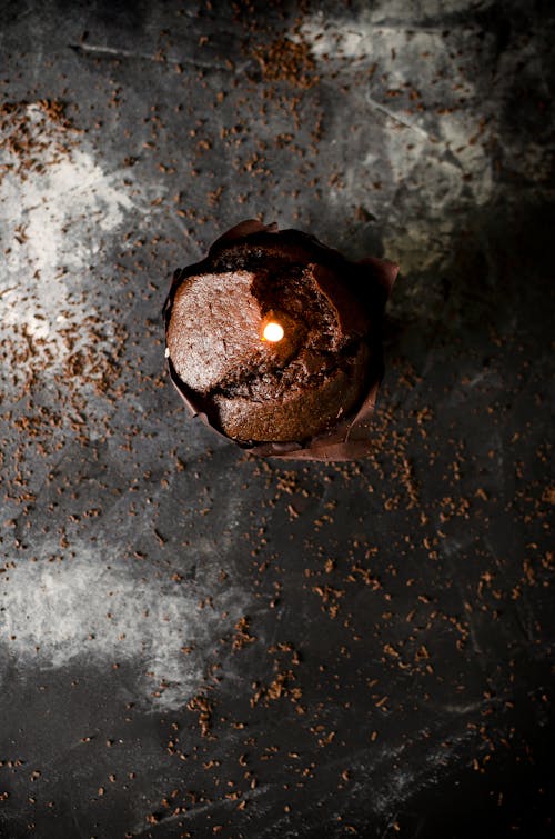 Overhead Shot of a Cupcake with Lighted Candle