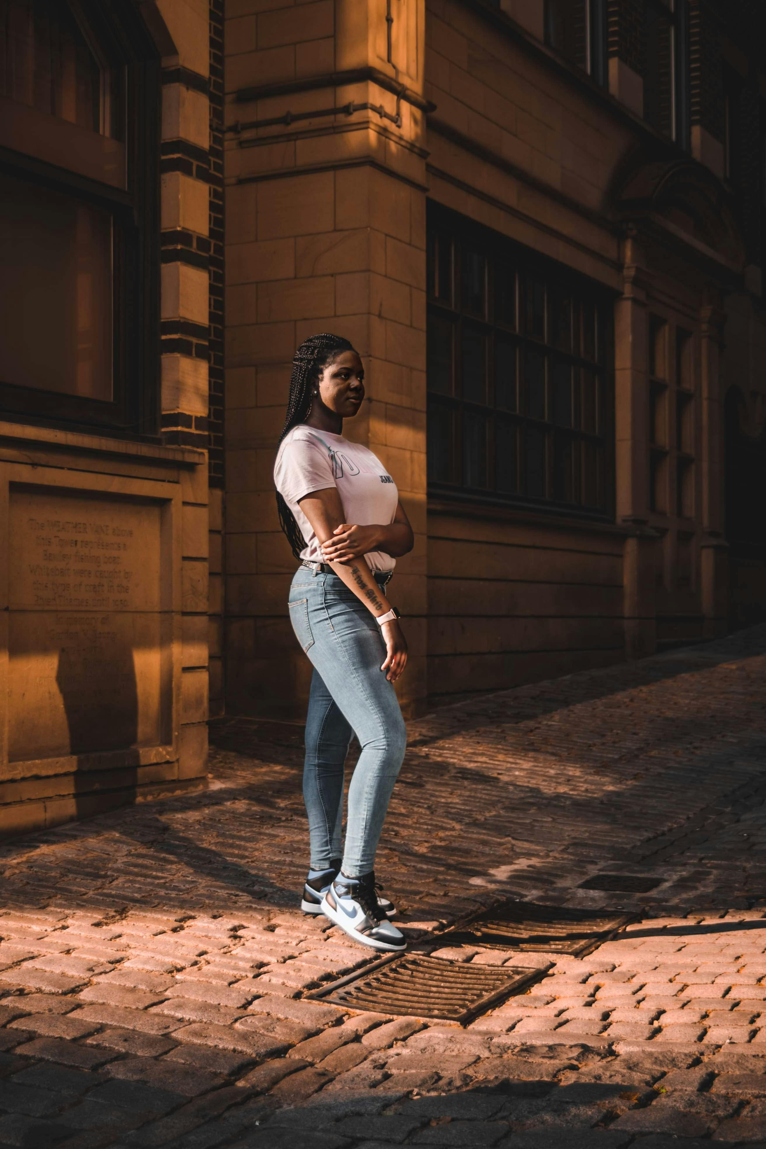 Premium Photo | Hipster girl wearing blank white tshirt jeans posing  against street old brick wall full length portrait minimalist urban  clothing style mockup for tshirt print store street fashion concept