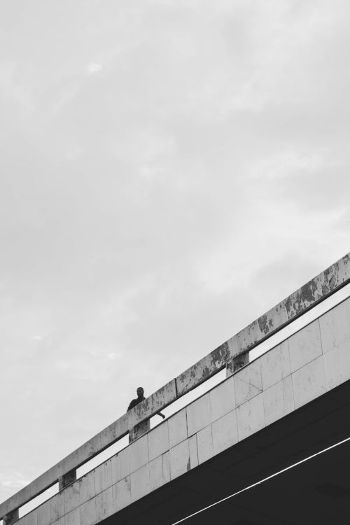 Free Monochrome image of a person standing on a modern bridge in Brasília, Brazil. Stock Photo