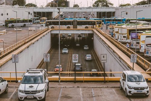 Free Busy urban overpass showing buses and cars commuting through a city intersection. Stock Photo