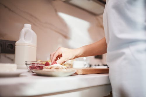 A Person Preparing Food on the Countertop