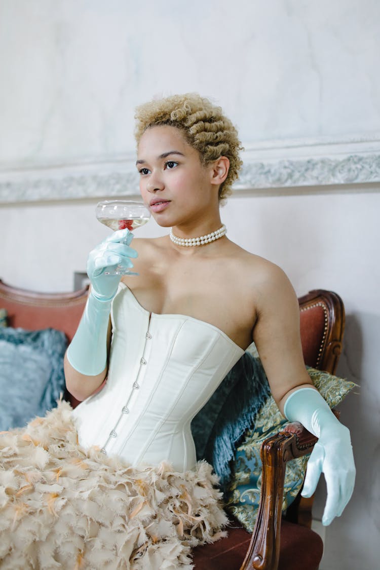 A Woman Wearing Beige Corset Dress 