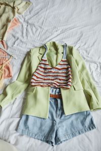 Flat lay of a linen jacket, striped top and shorts — Marcus Aurelius on Pexels
