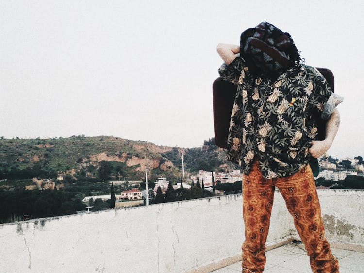 Person With Headscarf Carrying Bag