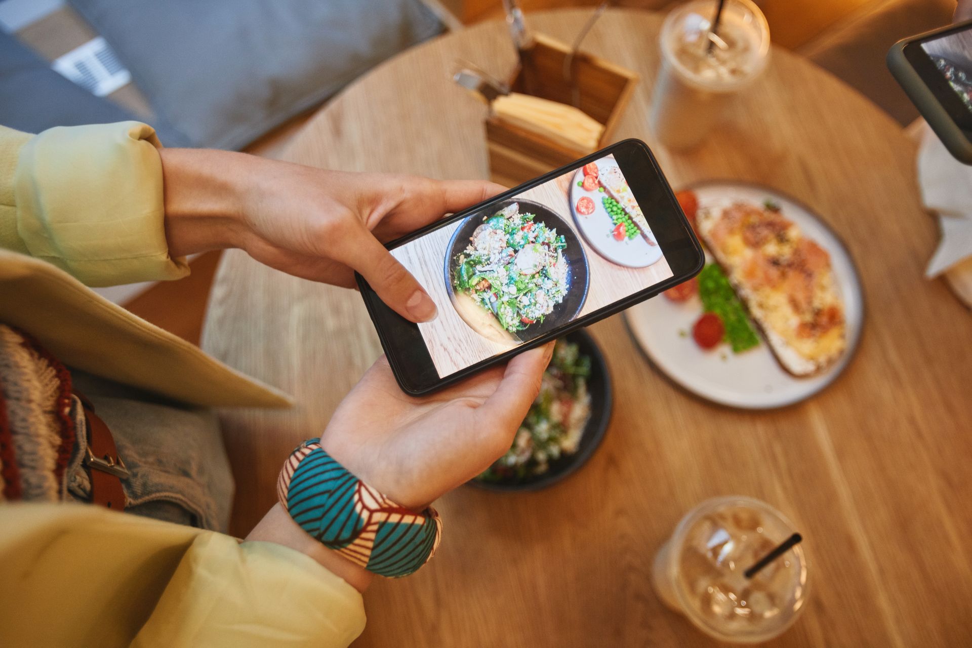 A Person Taking a Picture of Foods on the Table