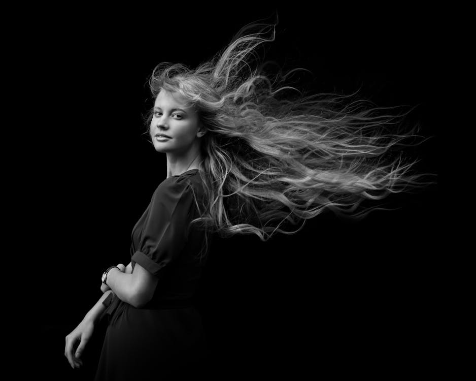 Grayscale Photo of Blonde Woman with Long Hair 