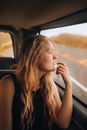 Woman in Black Tank Top Sitting on Car Seat