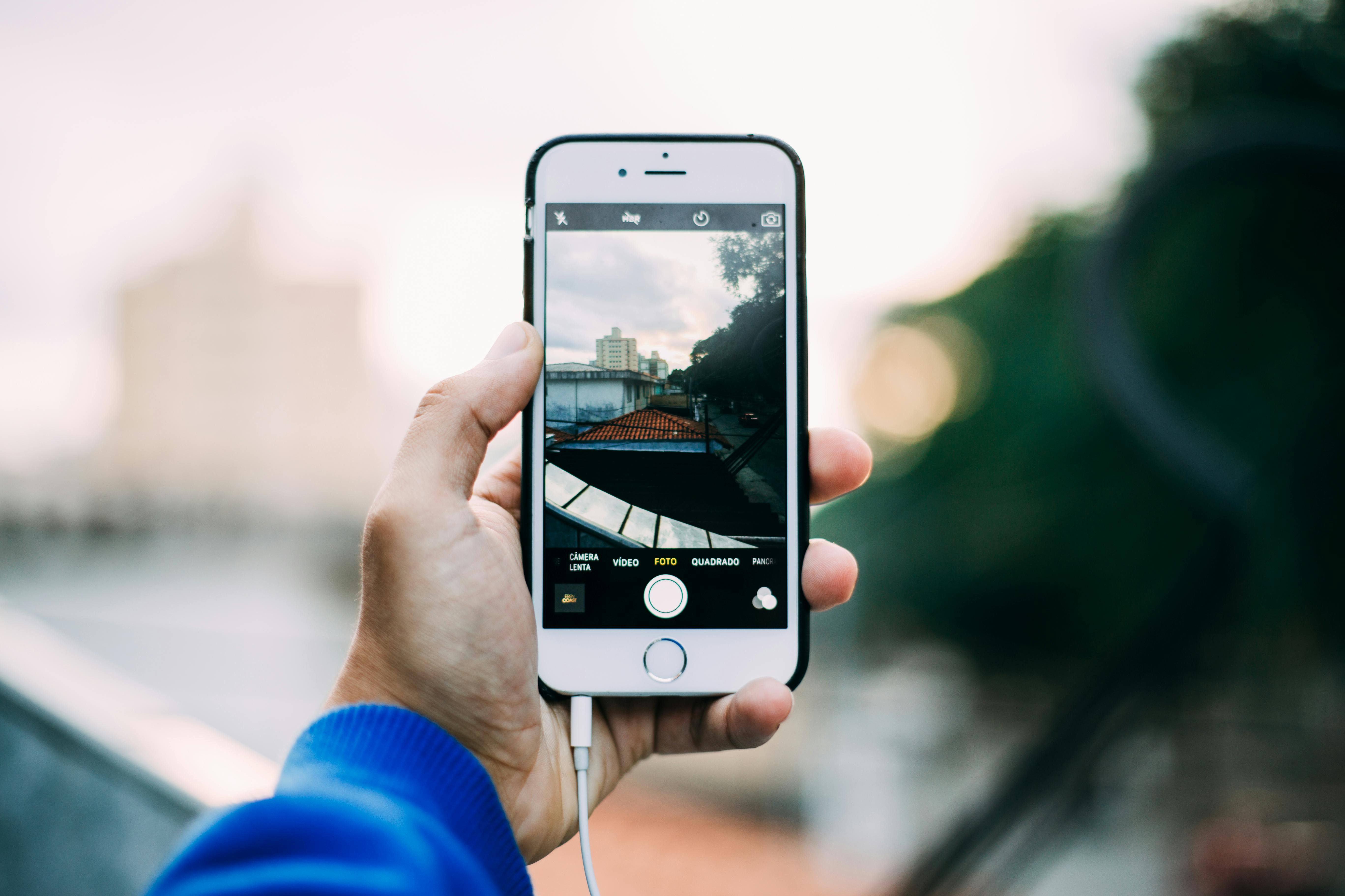 Person Holding Iphone 6 Outdoor · Free Stock Photo