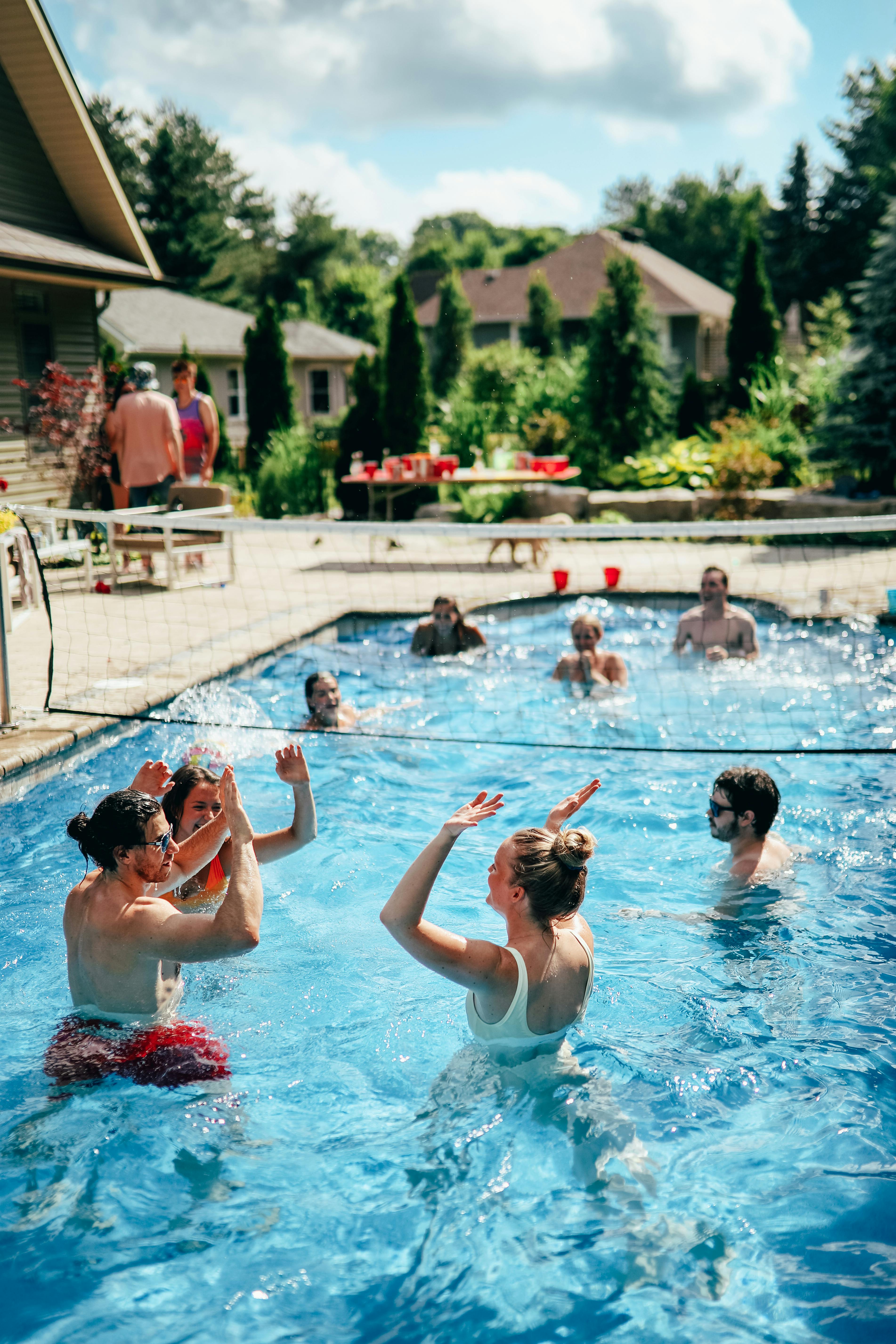A joyful gathering of friends enjoying a sunny pool party in Ontario, Canada. Perfect summer vibe!
