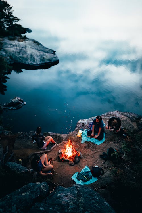 Friends Sitting Beside the Bonfire