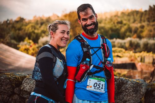 Free A couple of happy runners smiling after completing a trail running event outdoors. Stock Photo