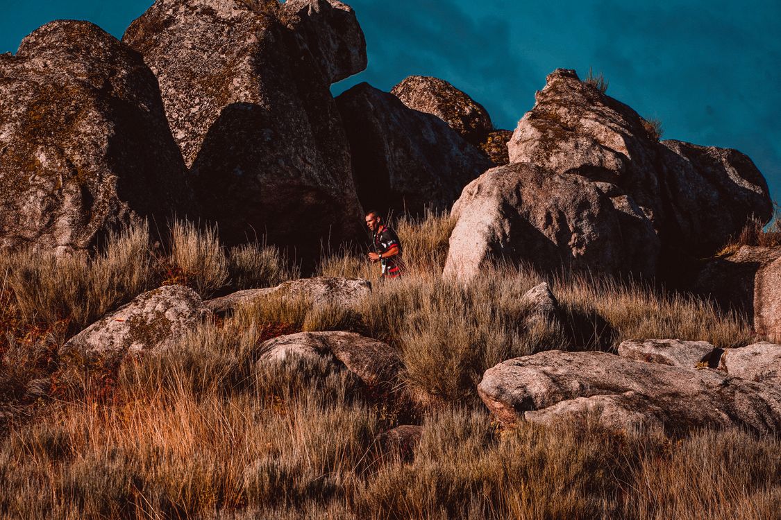 Guy Running Down Red Rocks Backwards Man Running by the Rocks · Free Stock Photo