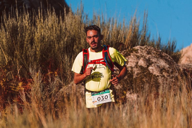 A Man Running In A Field