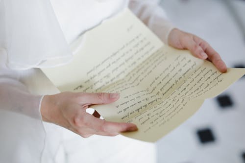 Free A Person Holding a Letter Stock Photo