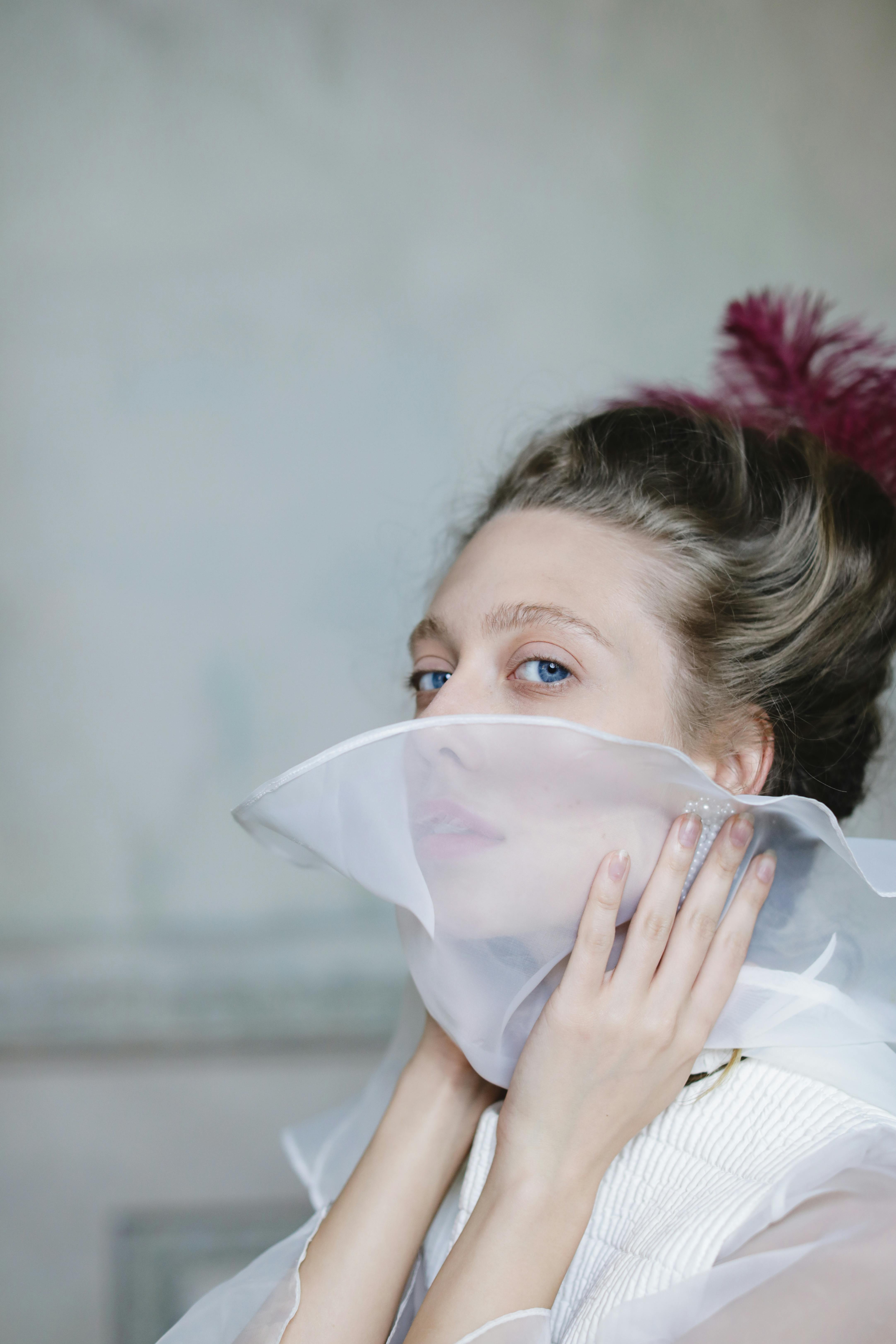 woman holding tulle collar of her dress