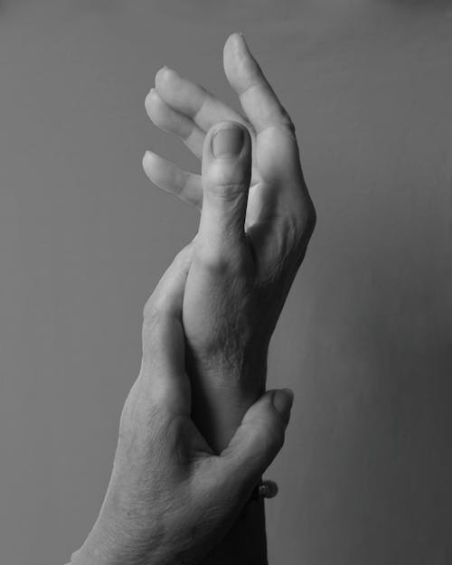 Grayscale Photography of Hands