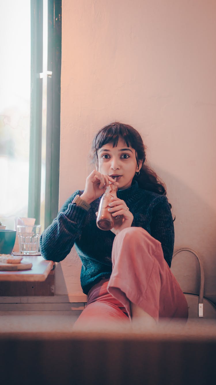 Photo Of A Girl Drinking From A Straw