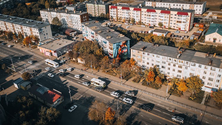 Apartment Buildings And Street In Town