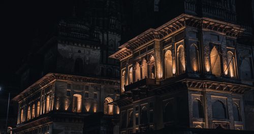 Free Night view of a beautifully illuminated historic building, showcasing stunning architectural details. Stock Photo