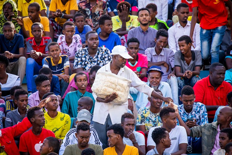 People Sitting In The Stadium