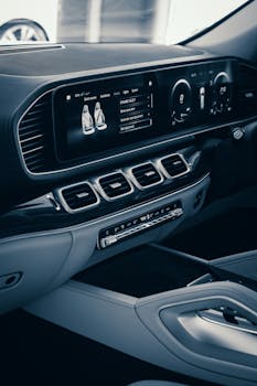 Close-up of a modern car interior featuring a sleek dashboard and digital display.
