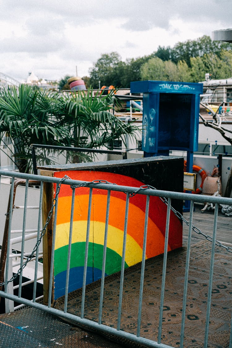 Rainbow Painting On Fence 