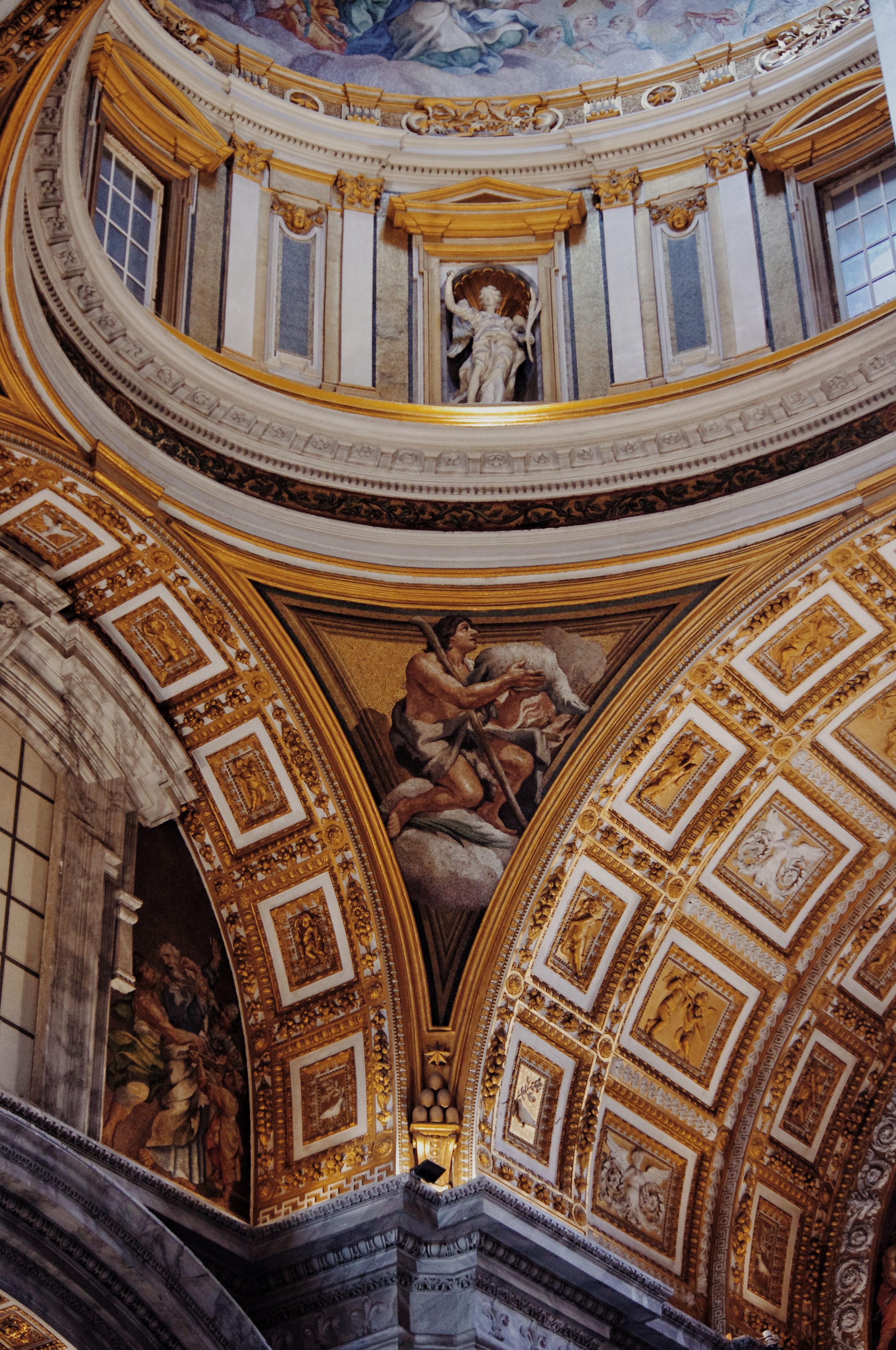 Detailed view of St. Peter's Basilica interior with classical frescoes and ornate architecture in Rome.