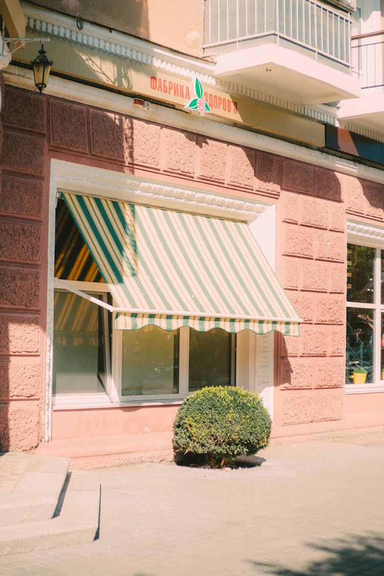 Beautiful Shop Exterior With Blinds On Entrance