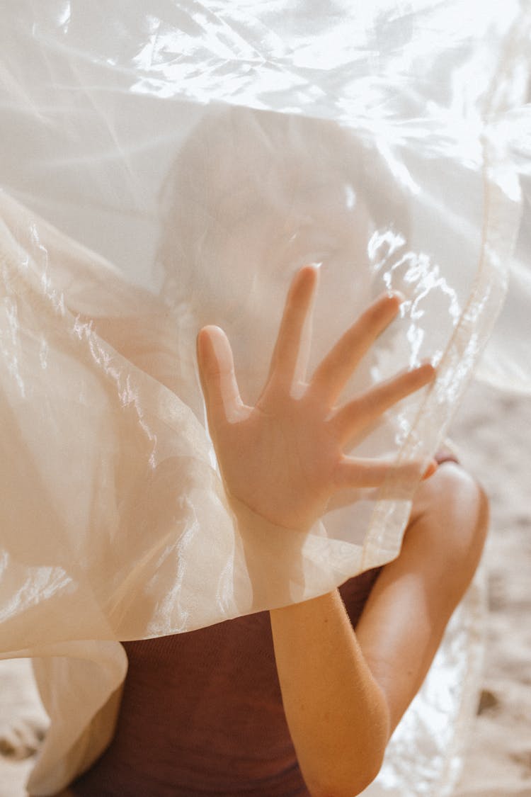 Person Holding A Sheer Fabric