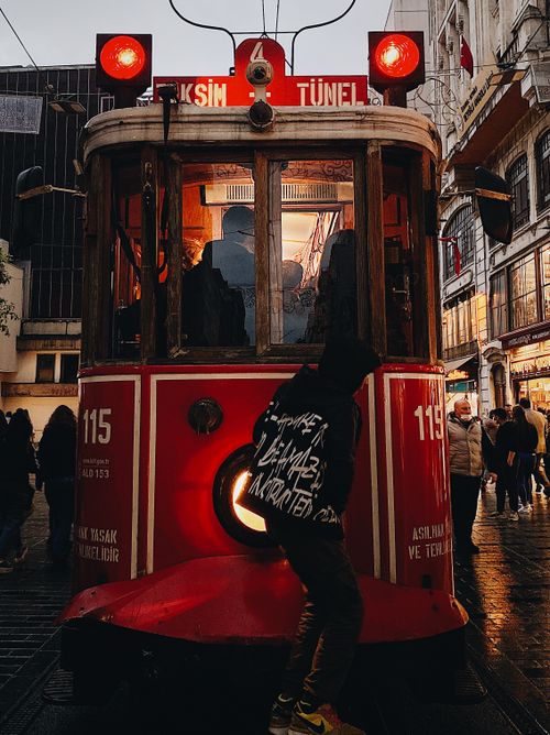Free A vibrant scene of the historic Taksim tram in Istanbul evening. Perfect for travel and urban imagery. Stock Photo