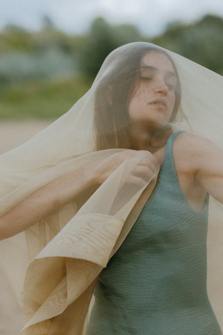 Woman Wrapped In See-through Fabric