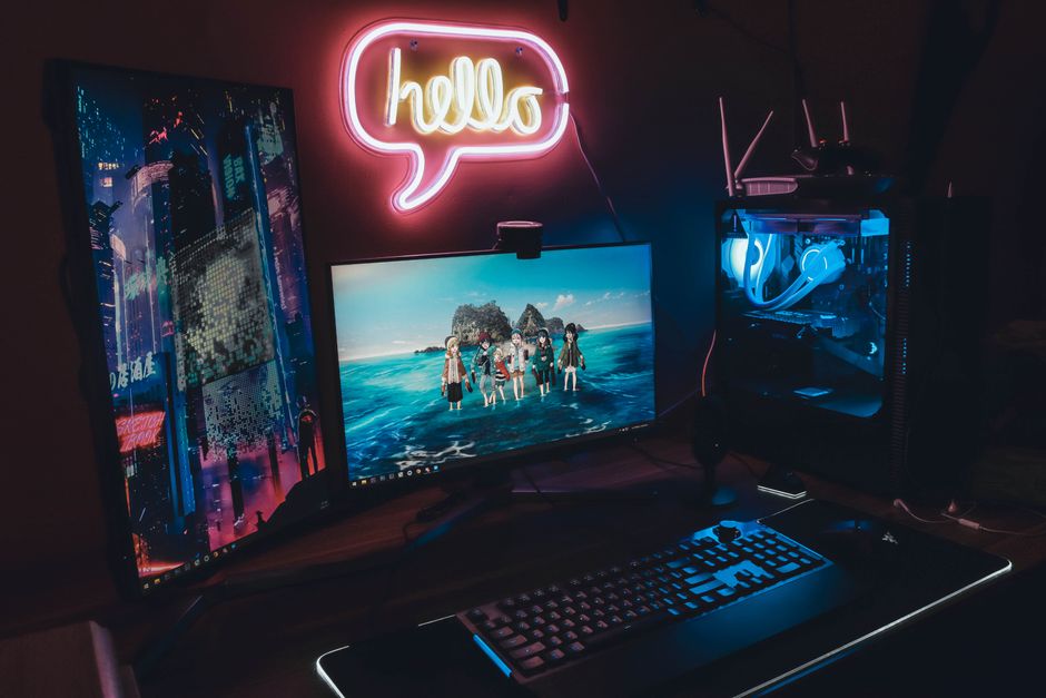 Neon-lit desk with music gear — Lynde on Pexels