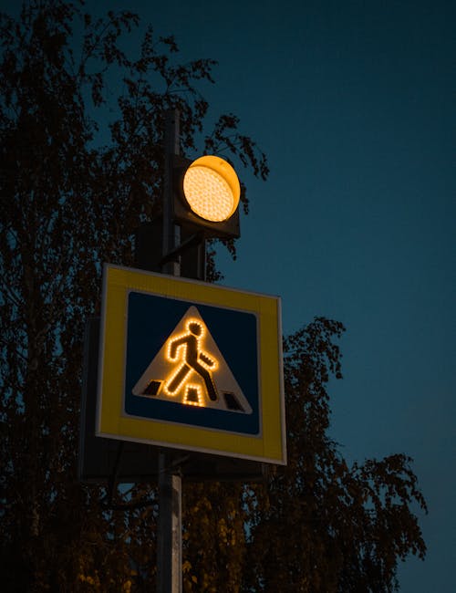 Free Pedestrian Crossing Road Sign During Night Stock Photo