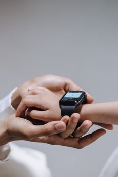 Patrick McEnroe reviewing data from wearable sensors for Parkinson's on a mobile device