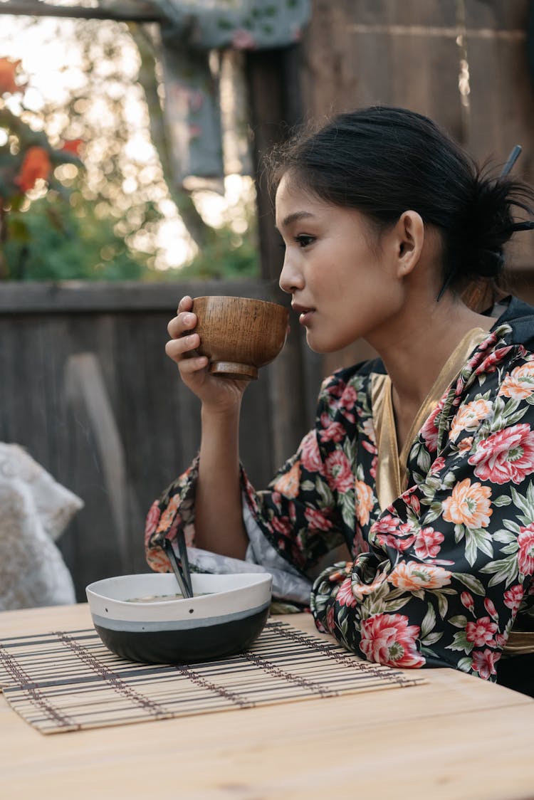 A Woman Drinking A Tea