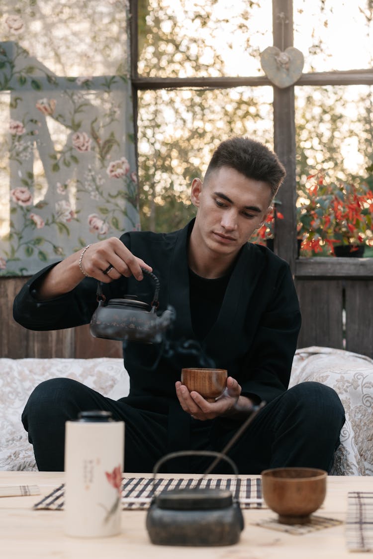 Man Pouring Tea