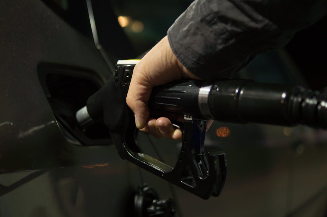 Person Holding Gasoline Nozzle