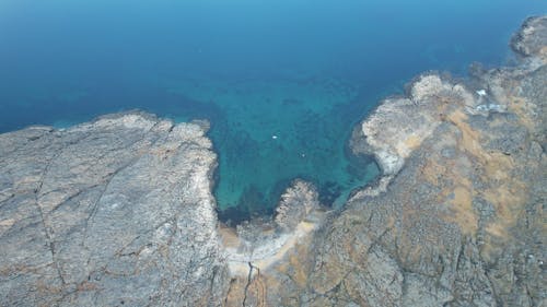 Free Aerial Photography of Rocky Coast near the Ocean Stock Photo