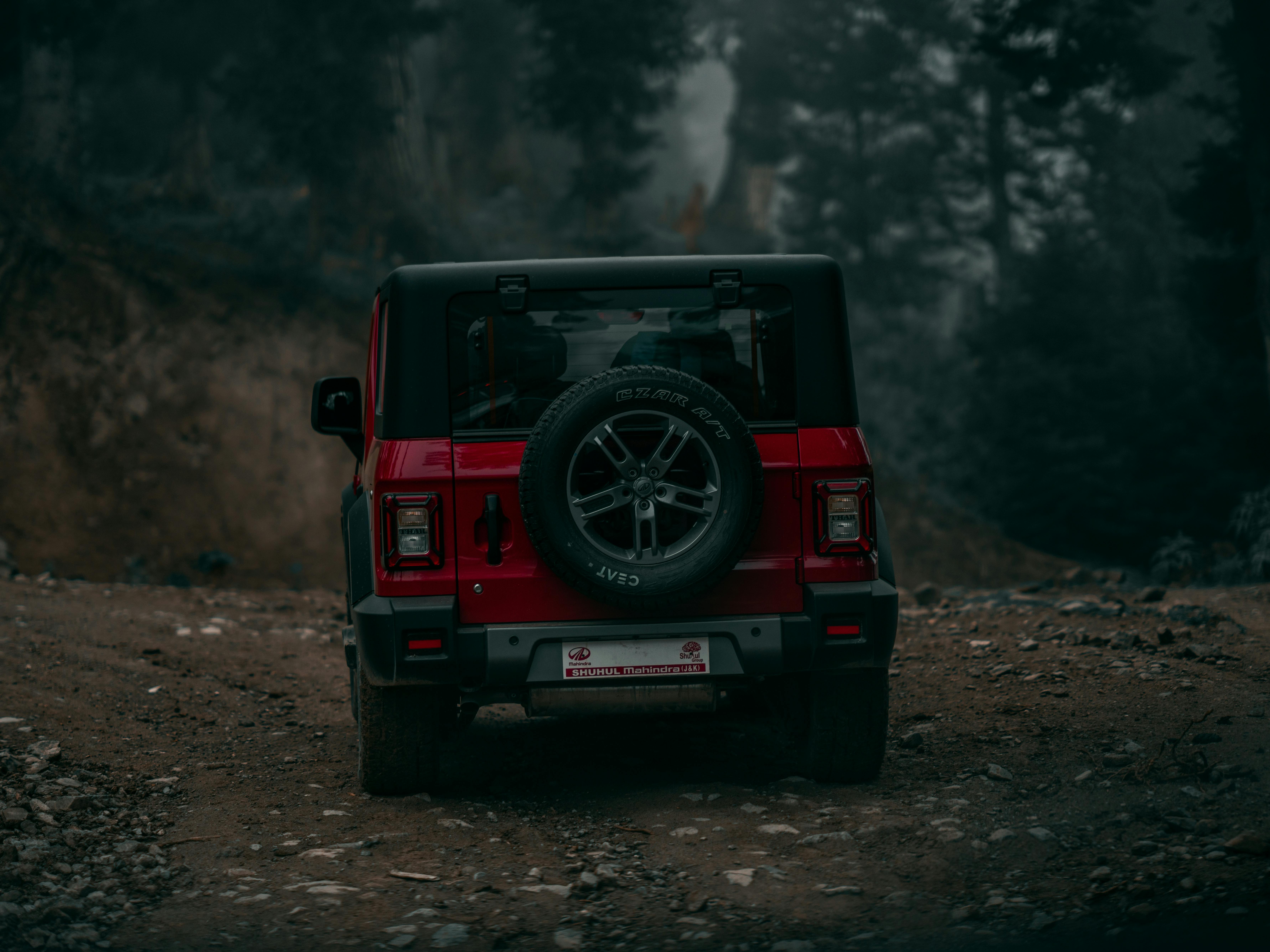 A Red Mahindra Thar on Dirt Road · Free Stock Photo