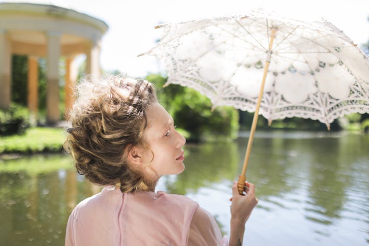 A Woman Holding An Umbrella