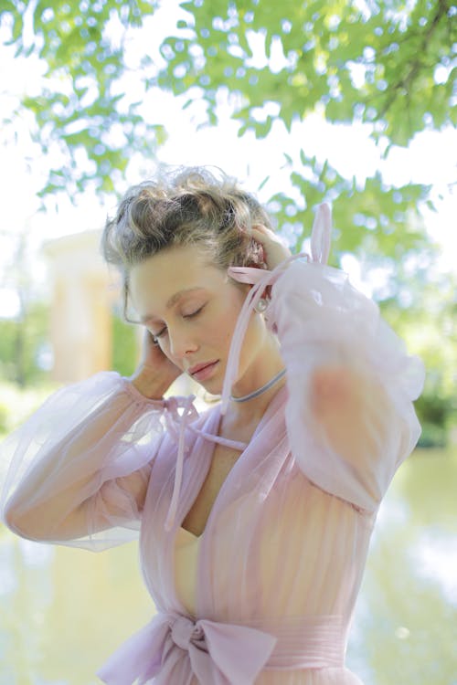 A Woman in Pink Chiffon Dress