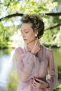 Woman in Long Sleeves Wearing Pearl Earrings