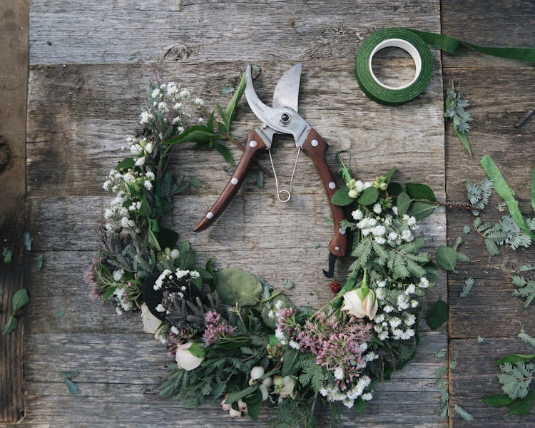 Pruning Shears And A Flower Wreath