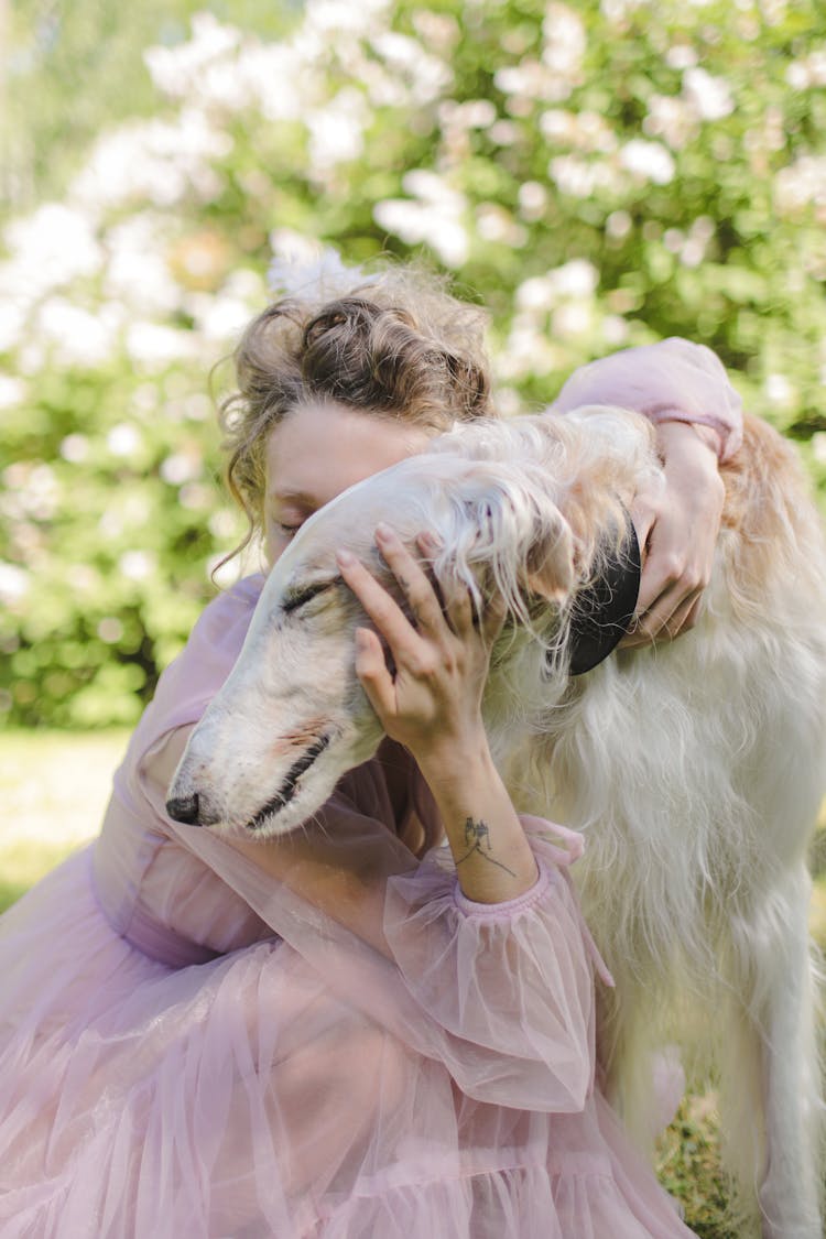 A Woman Embracing Her Dog