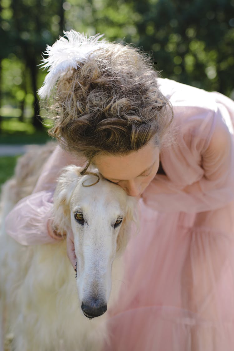 A Woman Embracing Her Pet Dog