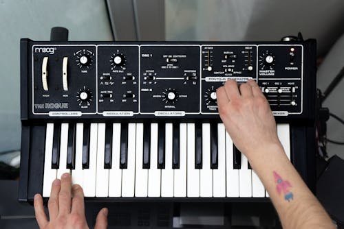 Man Hands Playing on Synthesizer